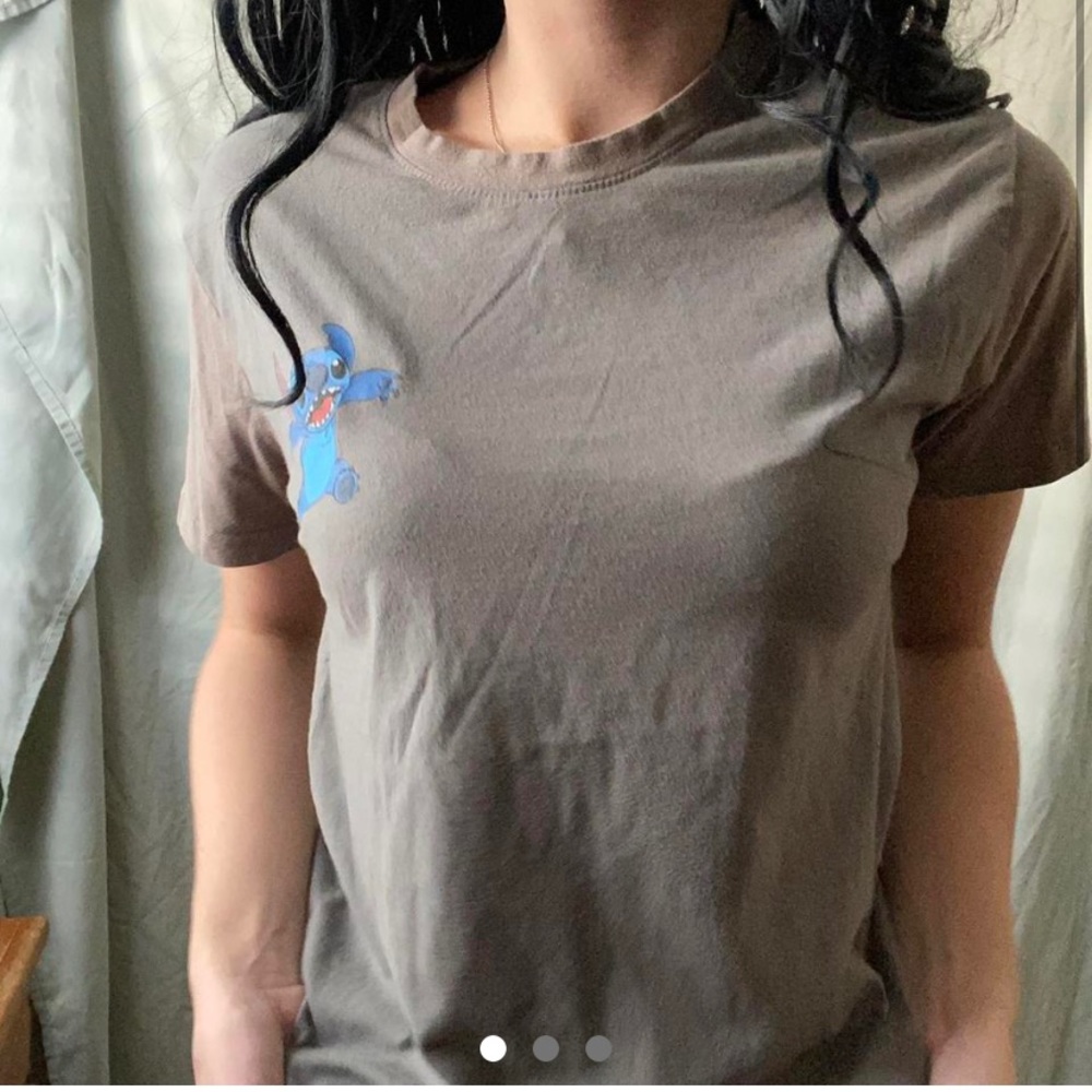 A Camo green, stitch shirt with
darker camo green sleeves and collar.